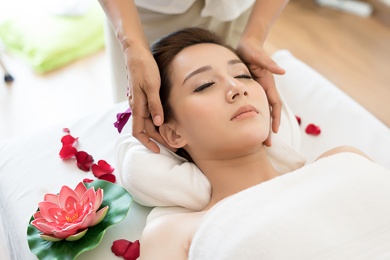 Traditional oriental massage therapy and beauty treatments. Youn Traditional oriental massage therapy and beauty treatments. Young beautiful have massage woman in spa salon.
